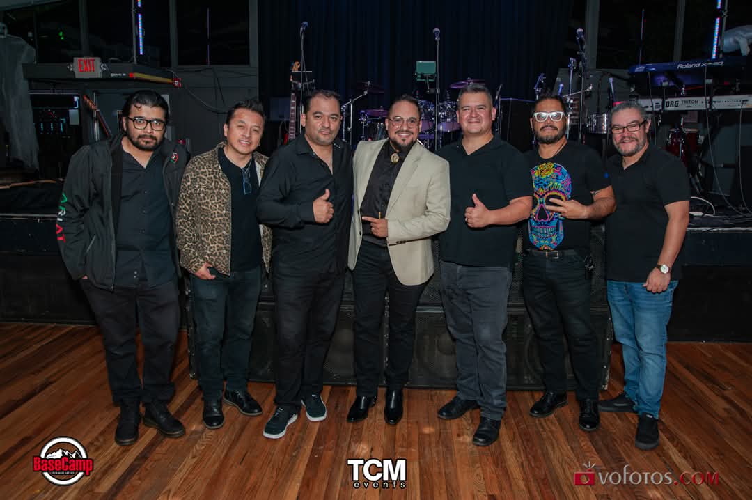 The musicians of the tribute band posing together after the show
